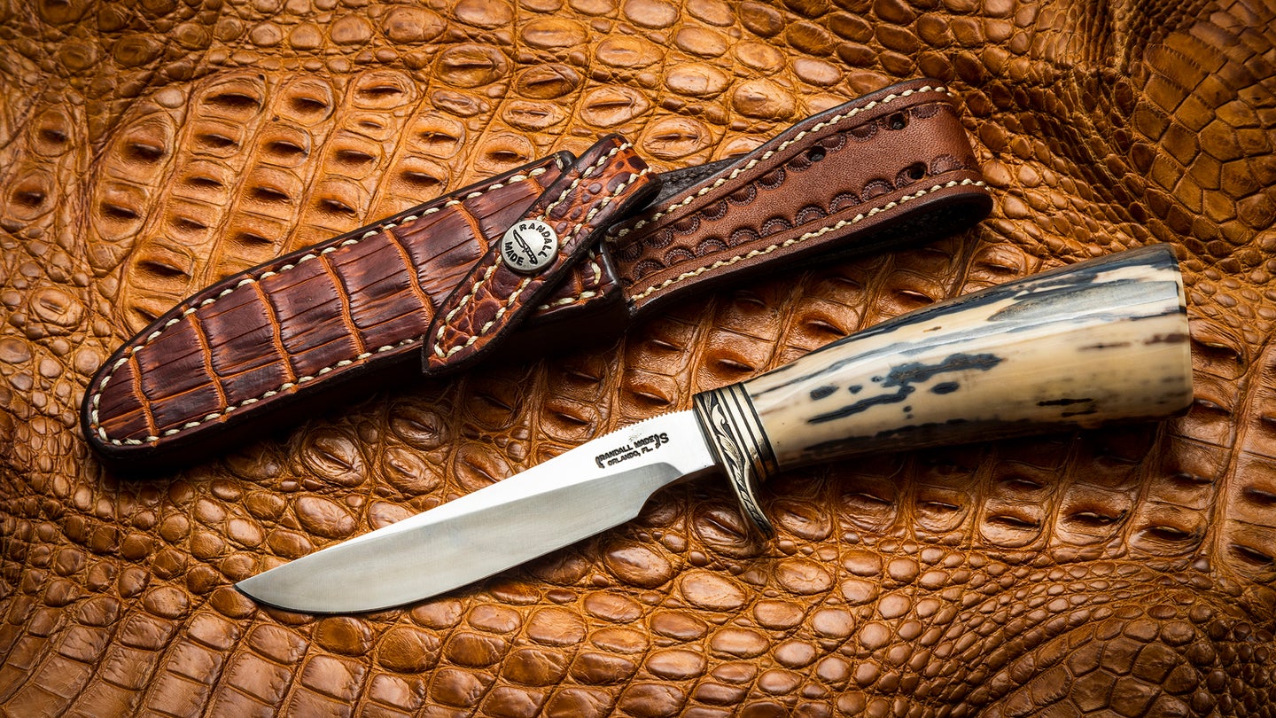 A modern example of a Model 7 Fisherman-Hunter. The handle is made from a piece of fossilized walrus ivory. The crocodile sheath was made by Greg Gutcher of Sullivan’s Leather.