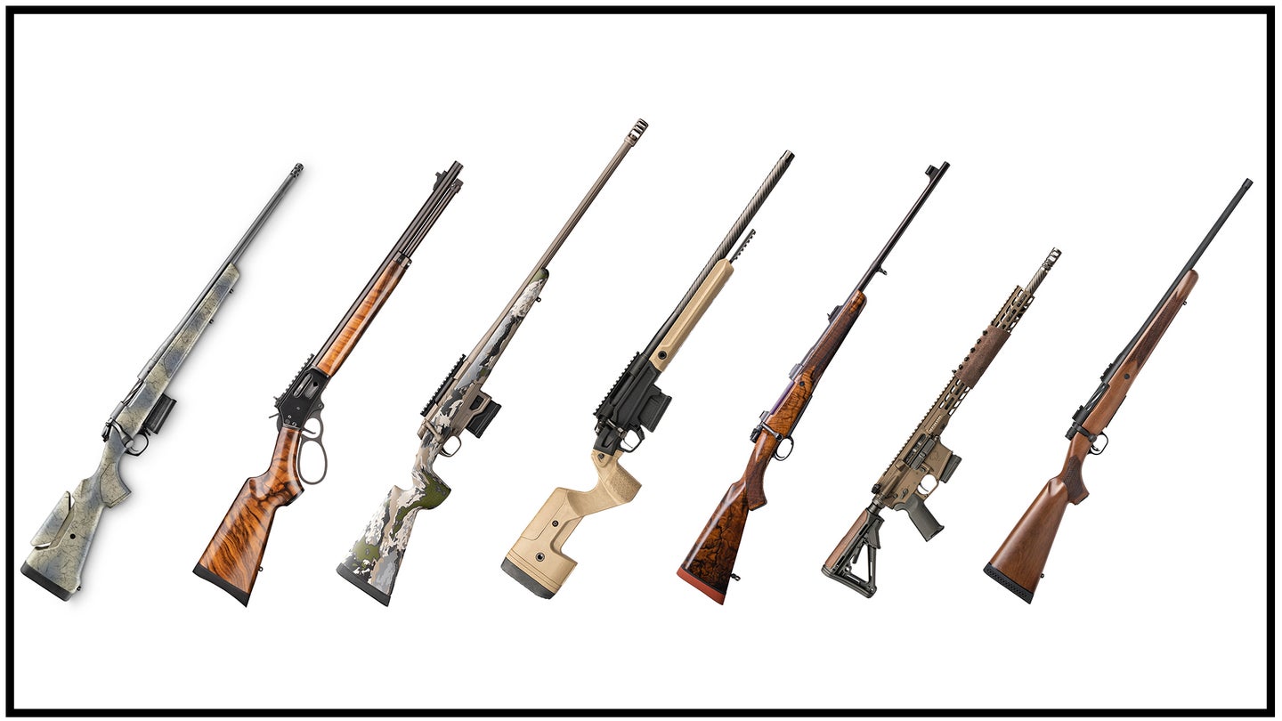 A group of seven new rifles on a white background