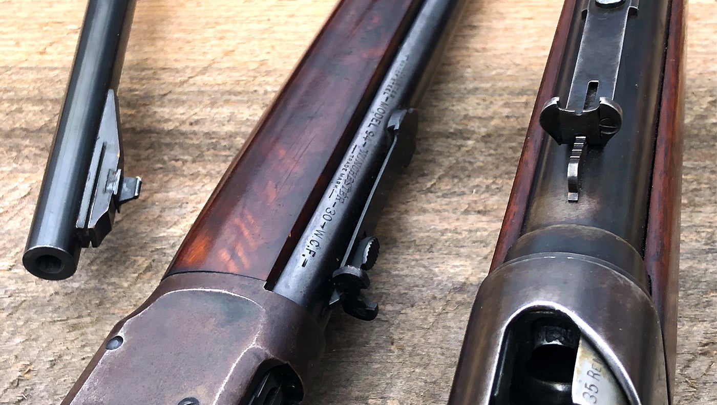 Iron sights on three classic deer rifles.