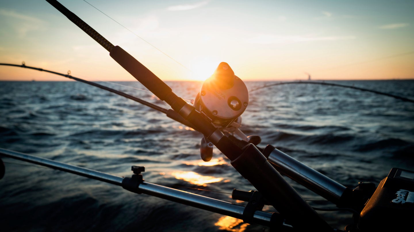 A rod sits in the holder while trolling for salmon on Lake Ontario.