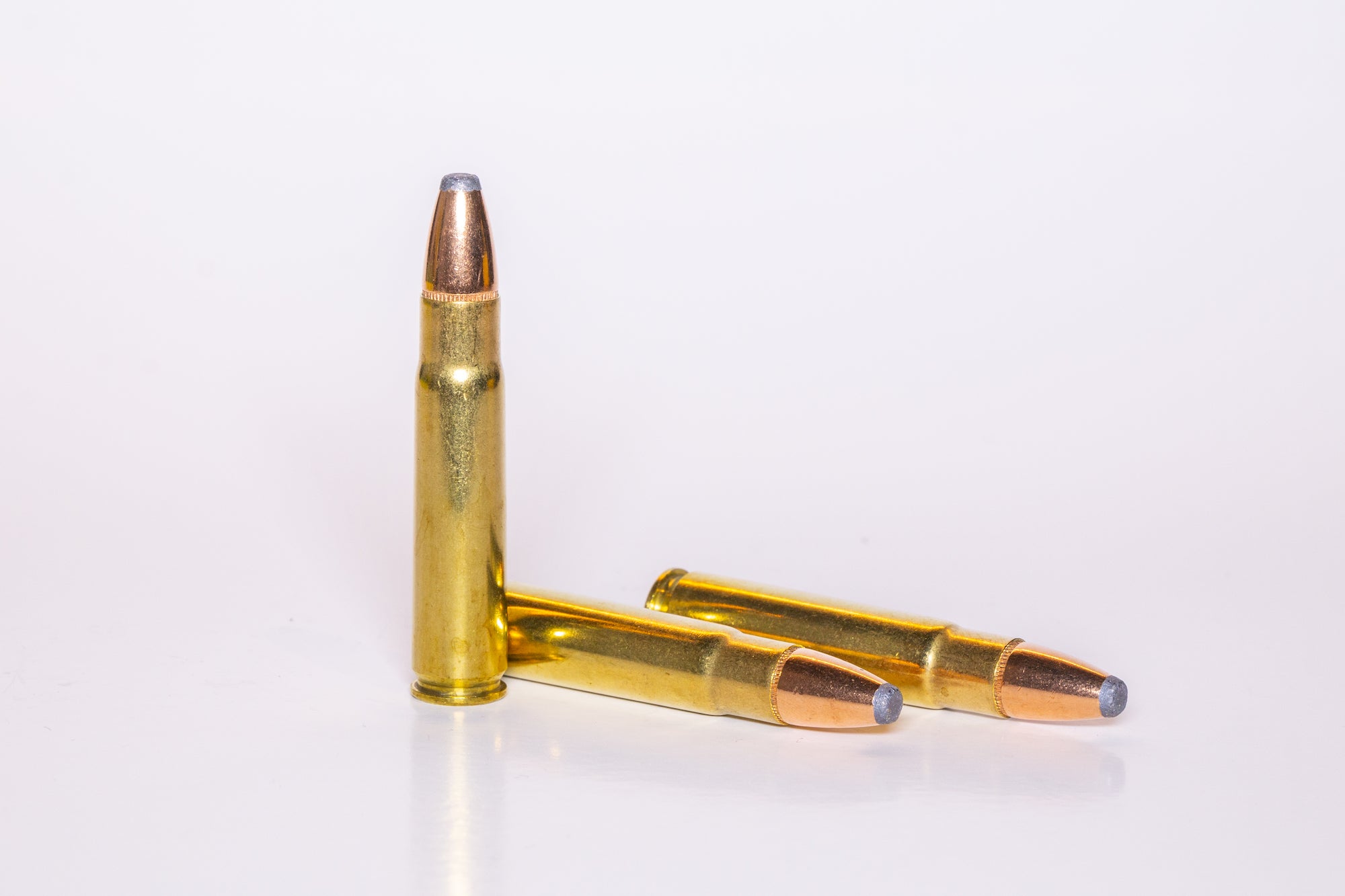Rifle cartridge on a white background.