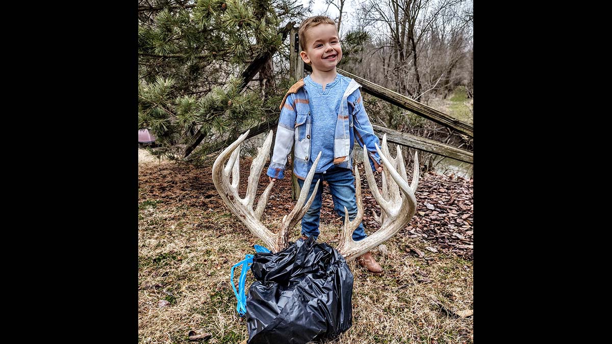 boy with large deer antlers