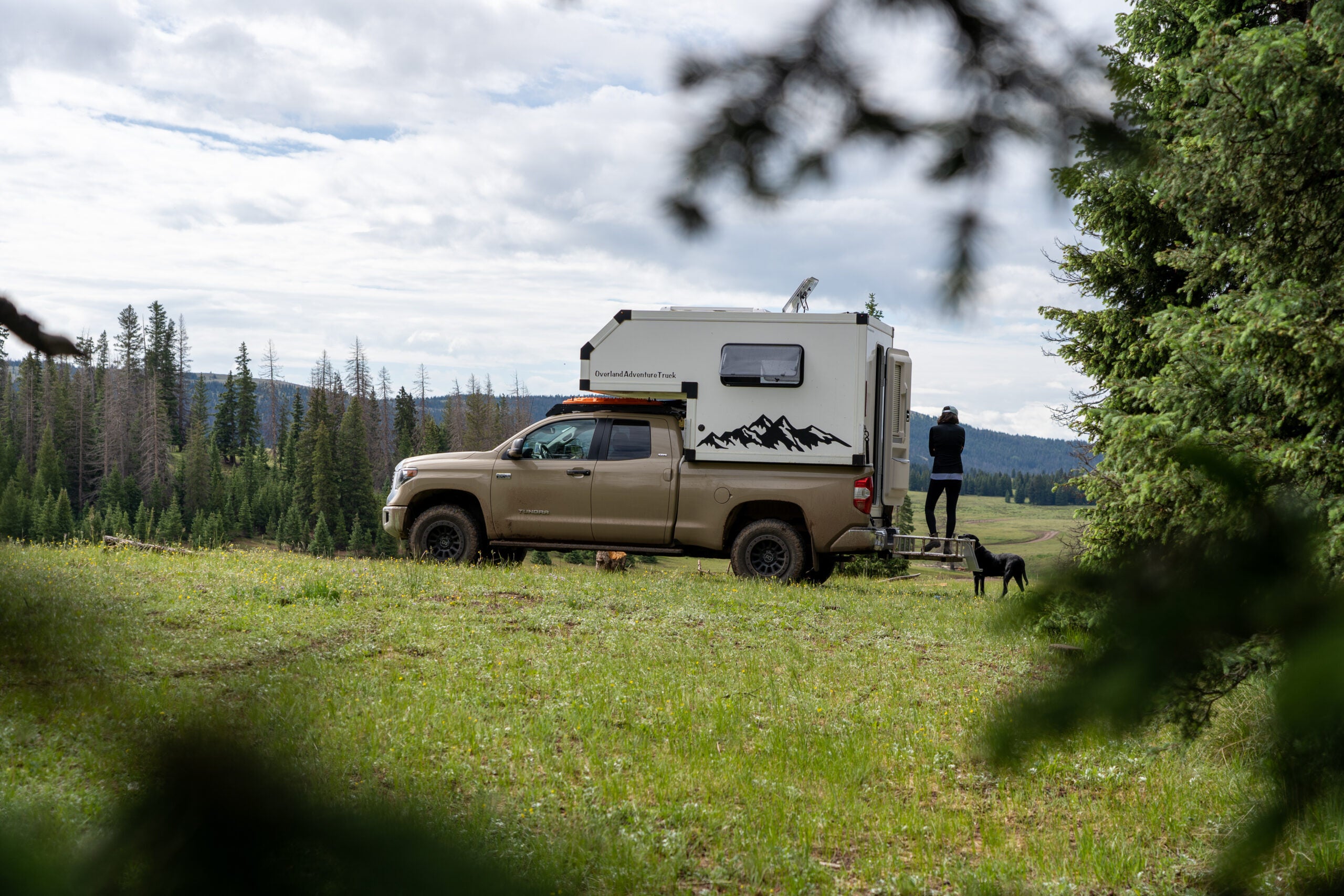 A pick-up truck set up for camping.