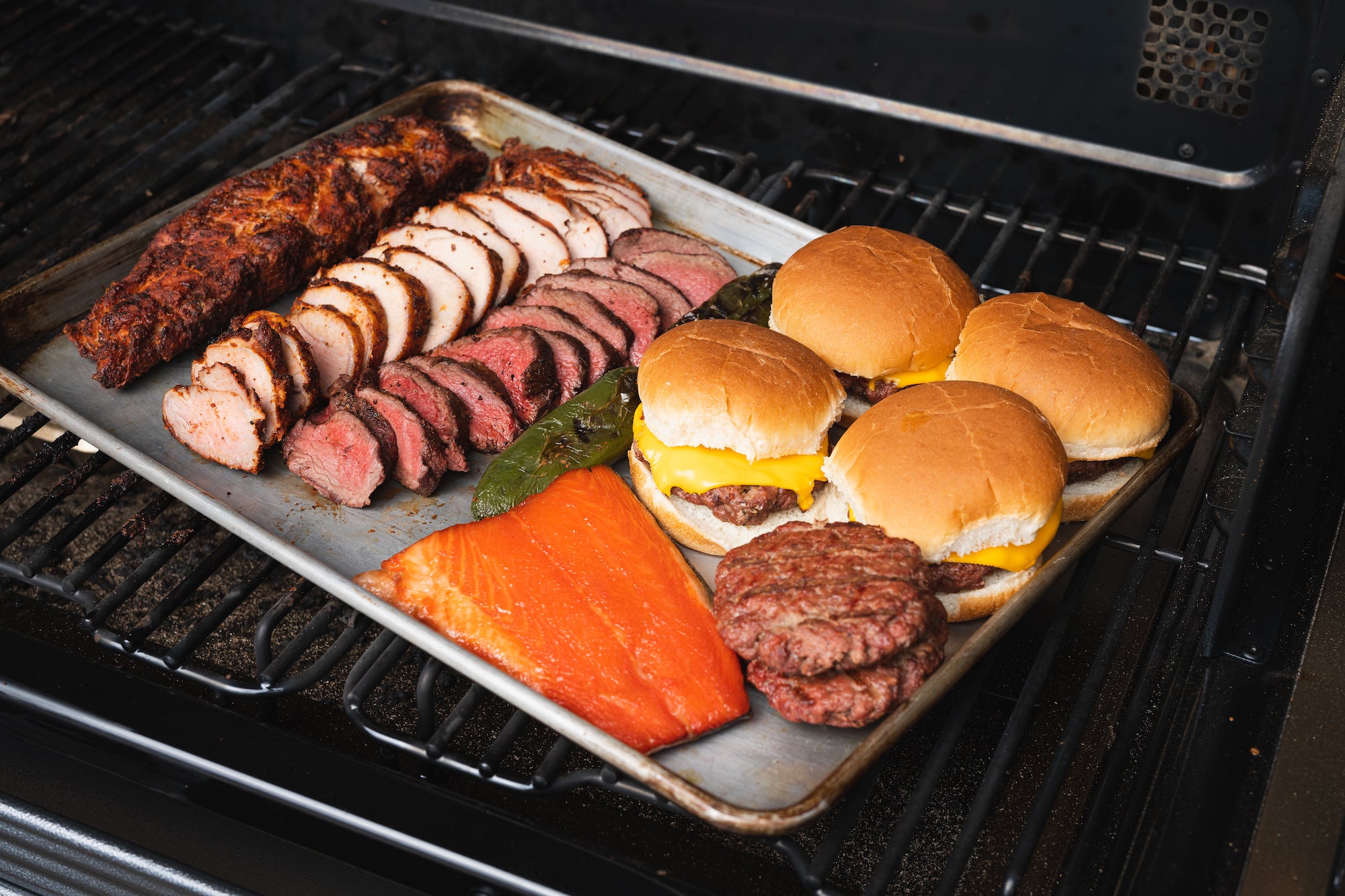 Tray of food on a Traeger Ironwood Grill.