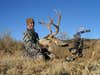 photo of hunter with mule deer buck