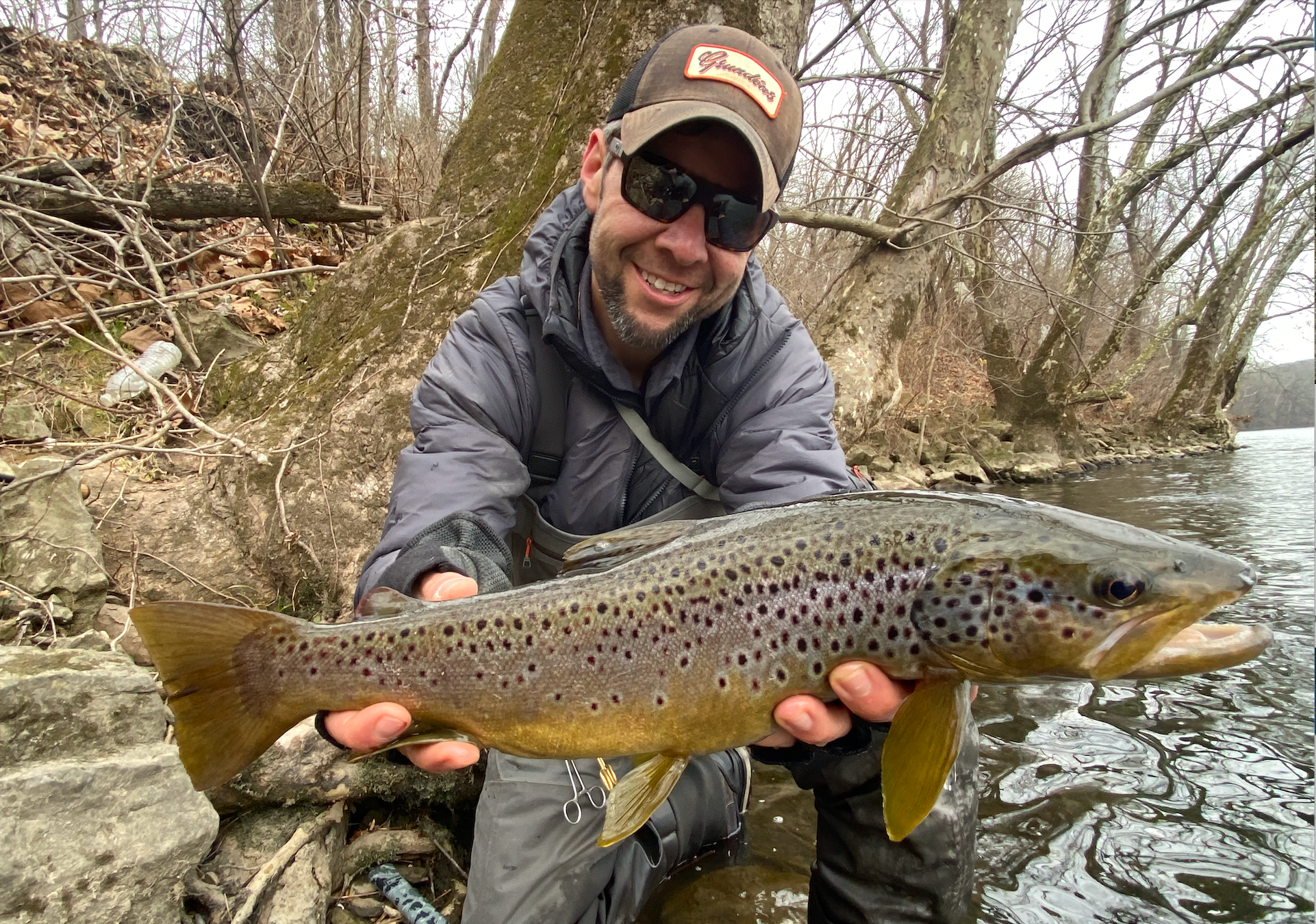 photo of angler with a brown trout