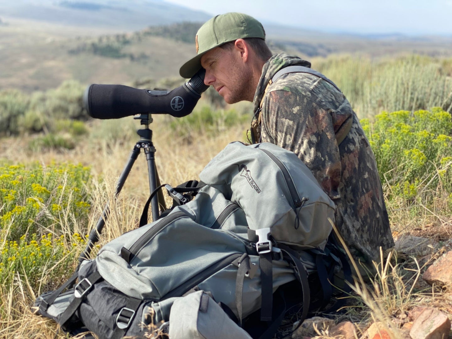 hunter glassing with spotting scope