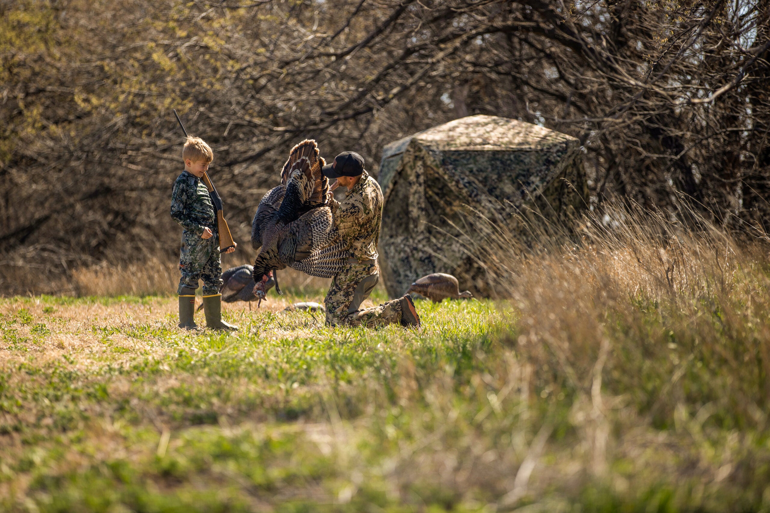photo of father and son turkey hunting