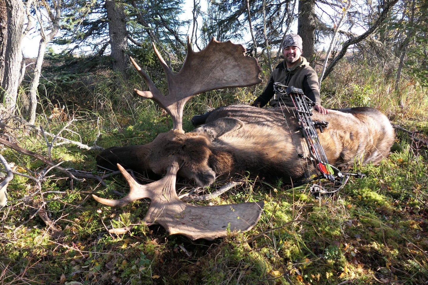 Man with a dead moose.