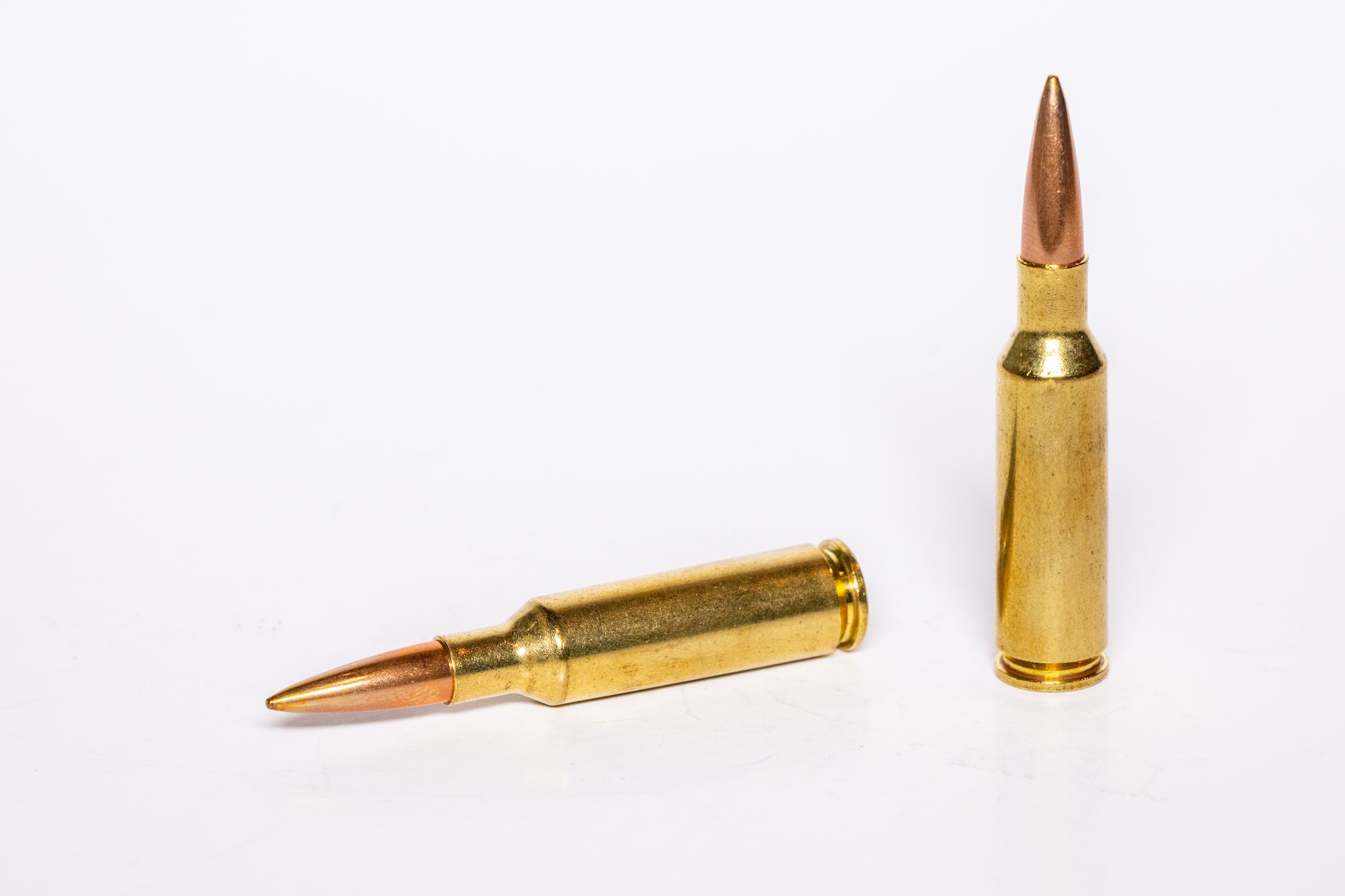 Rifle cartridge on a white background.