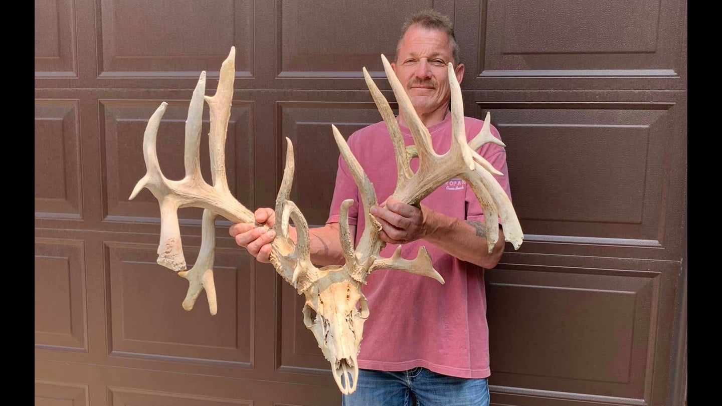 photo of man with huge whitetail rack