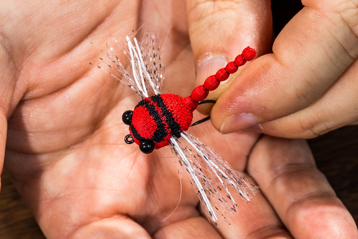 red and black damselfly lure made from deer hair