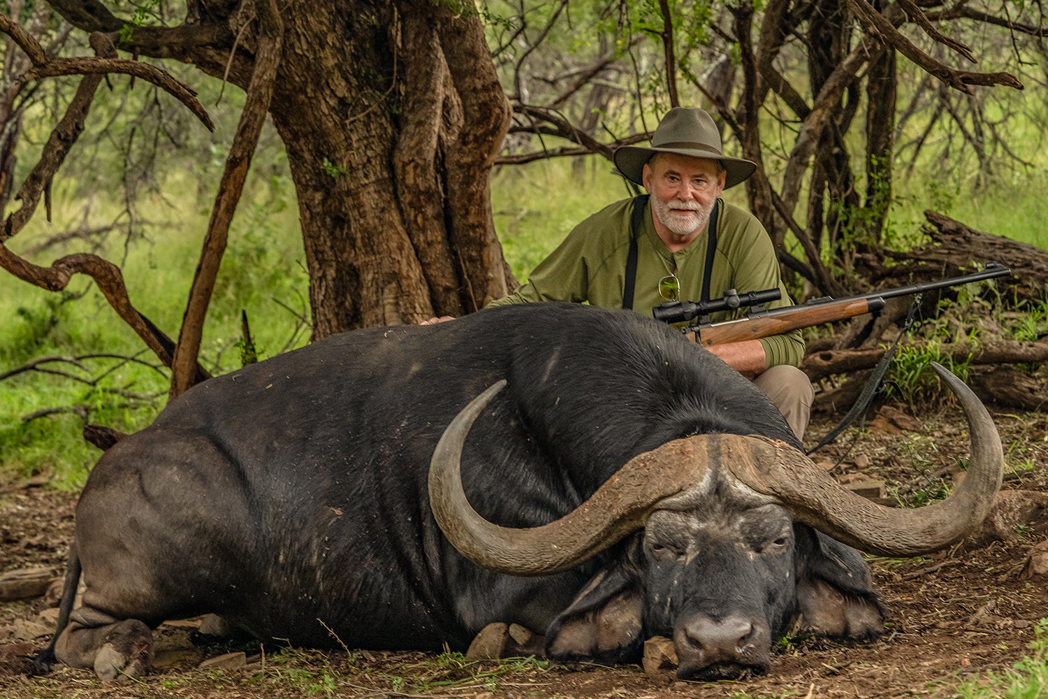 hunter poses with cape buffalo