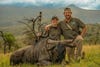 hunters with wildebeest