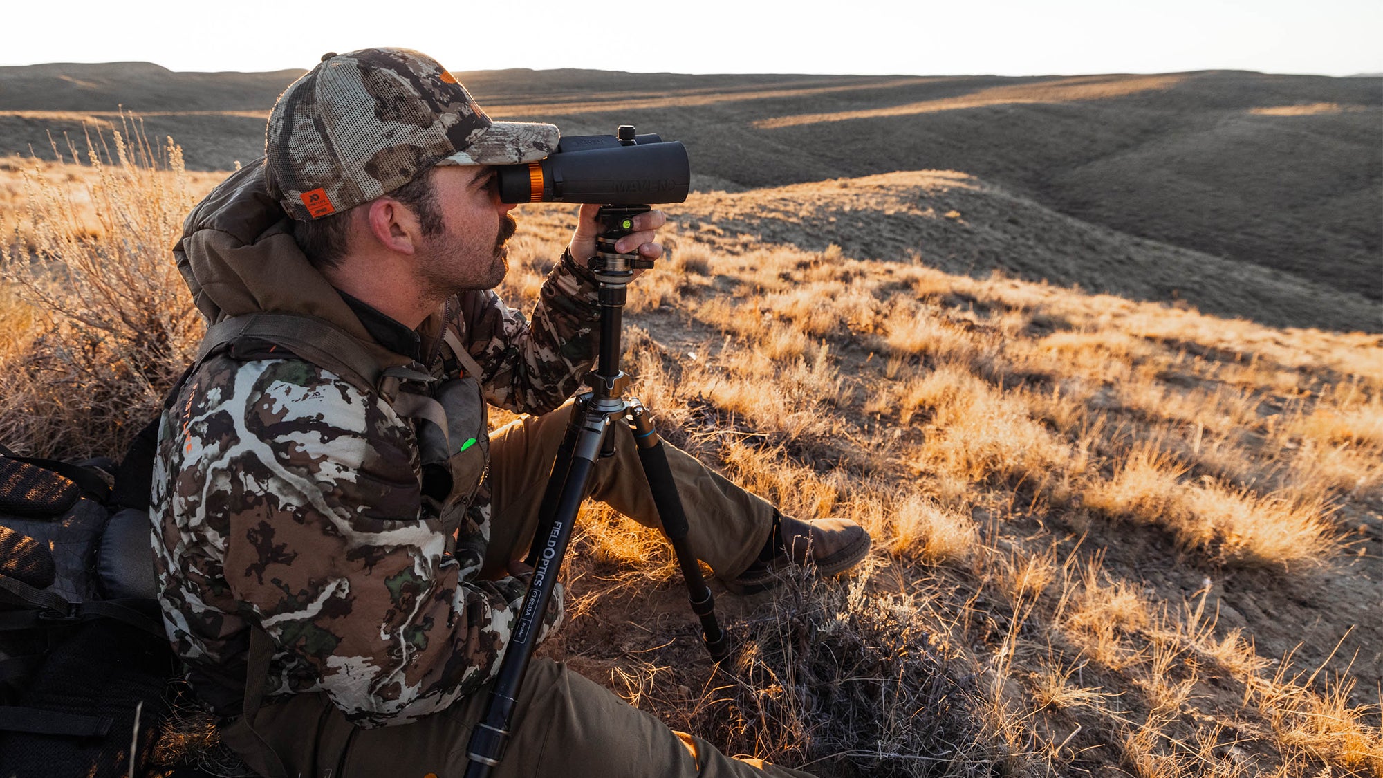 photo of hunter using binocular