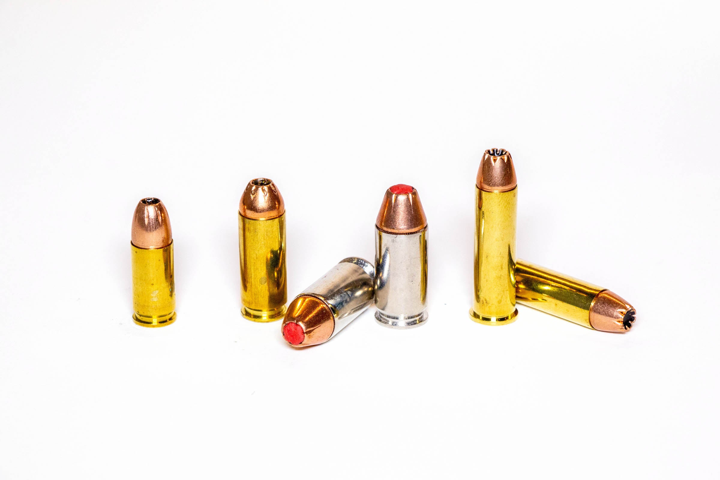 Handgun cartridges on a white background.