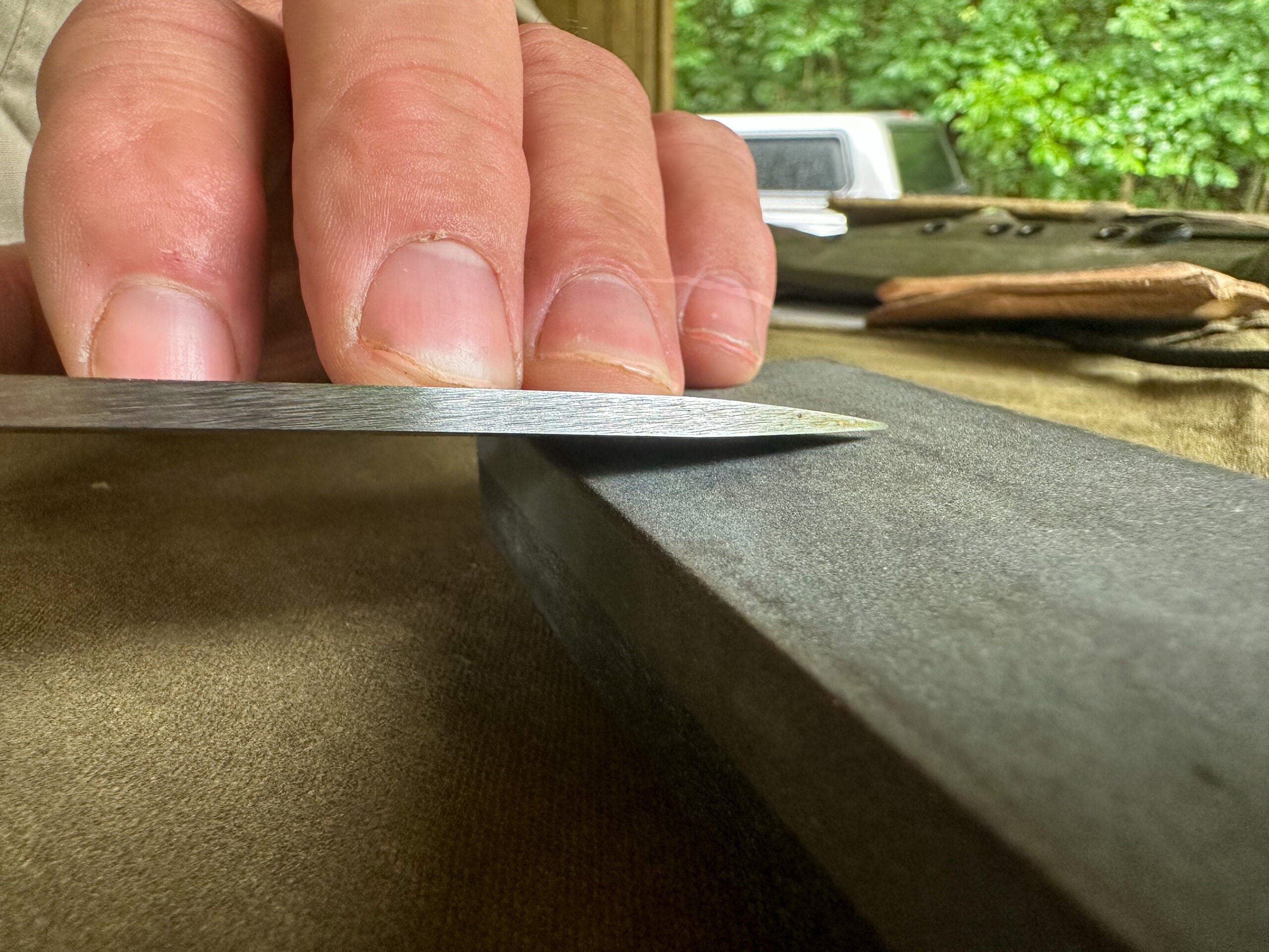Sharpening a knife on a whetstone