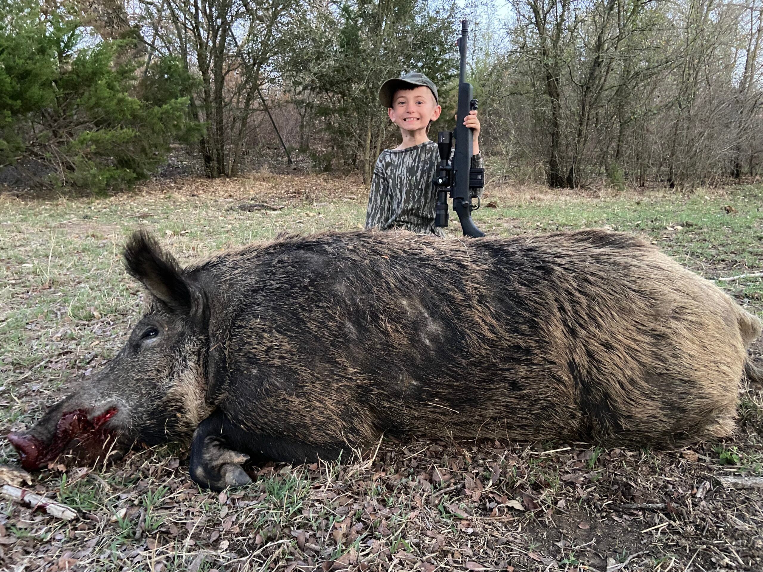 photo of a huge wild hog taken with a 300 Blackout by the authors son