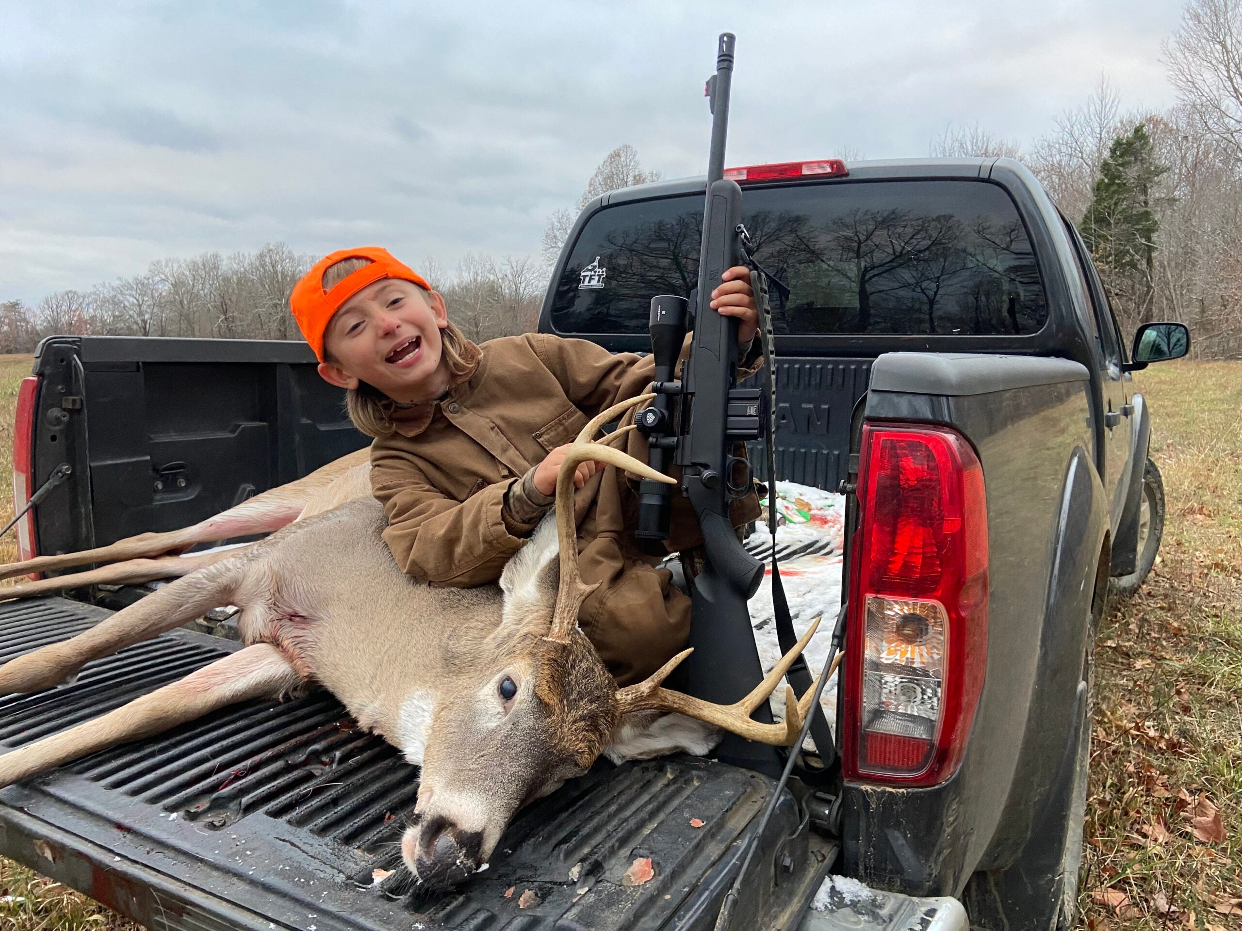 photo of author's son with another whitetail buck taken with a 300 Blackout