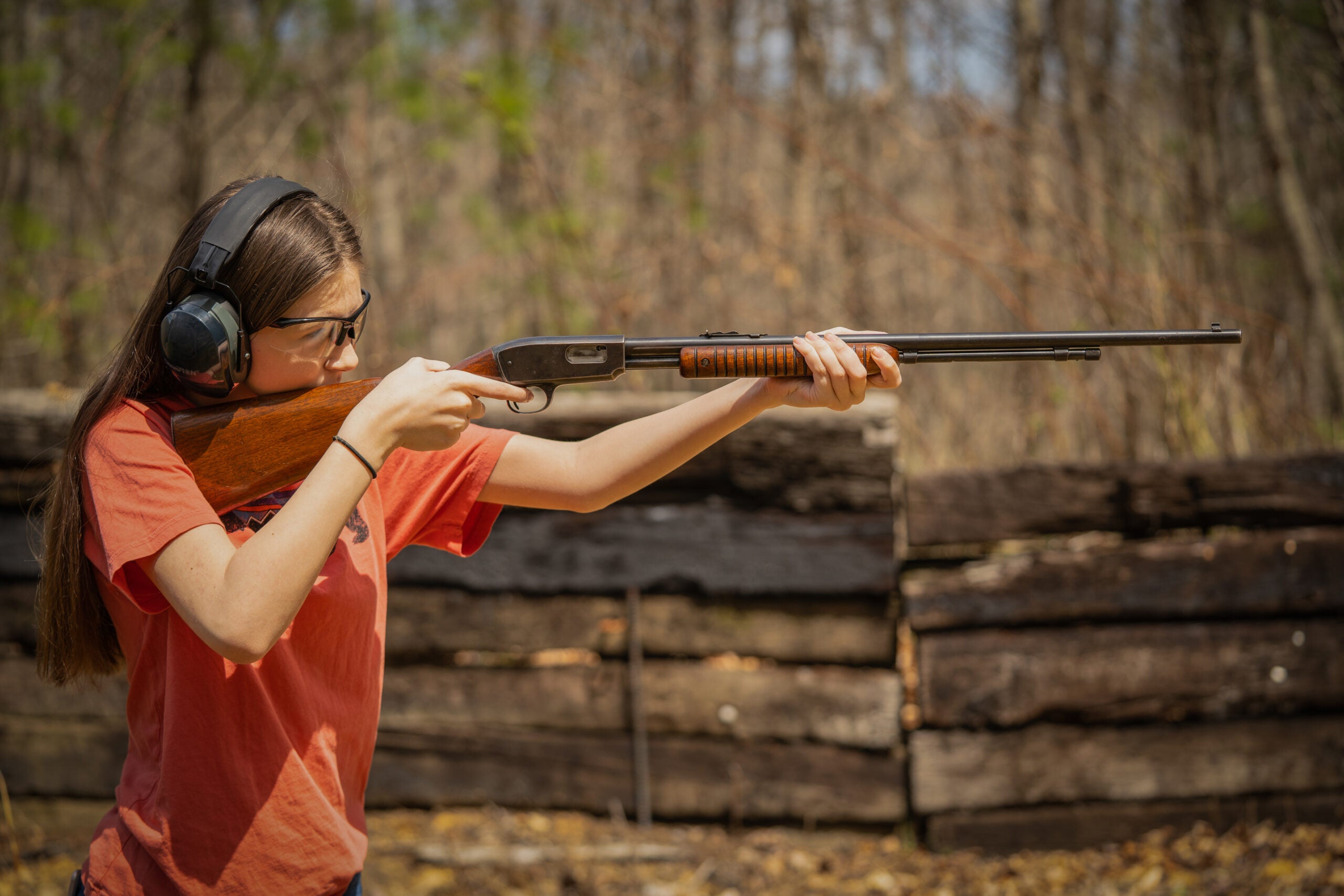young kid shooting a 22 rifle