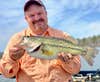 The author with a five pound largemouth bass caught in Central Arkansas.