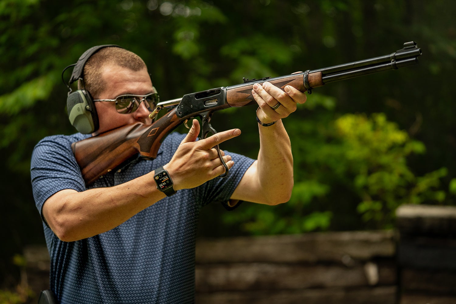 shooter holding marlin rifle runs lever action