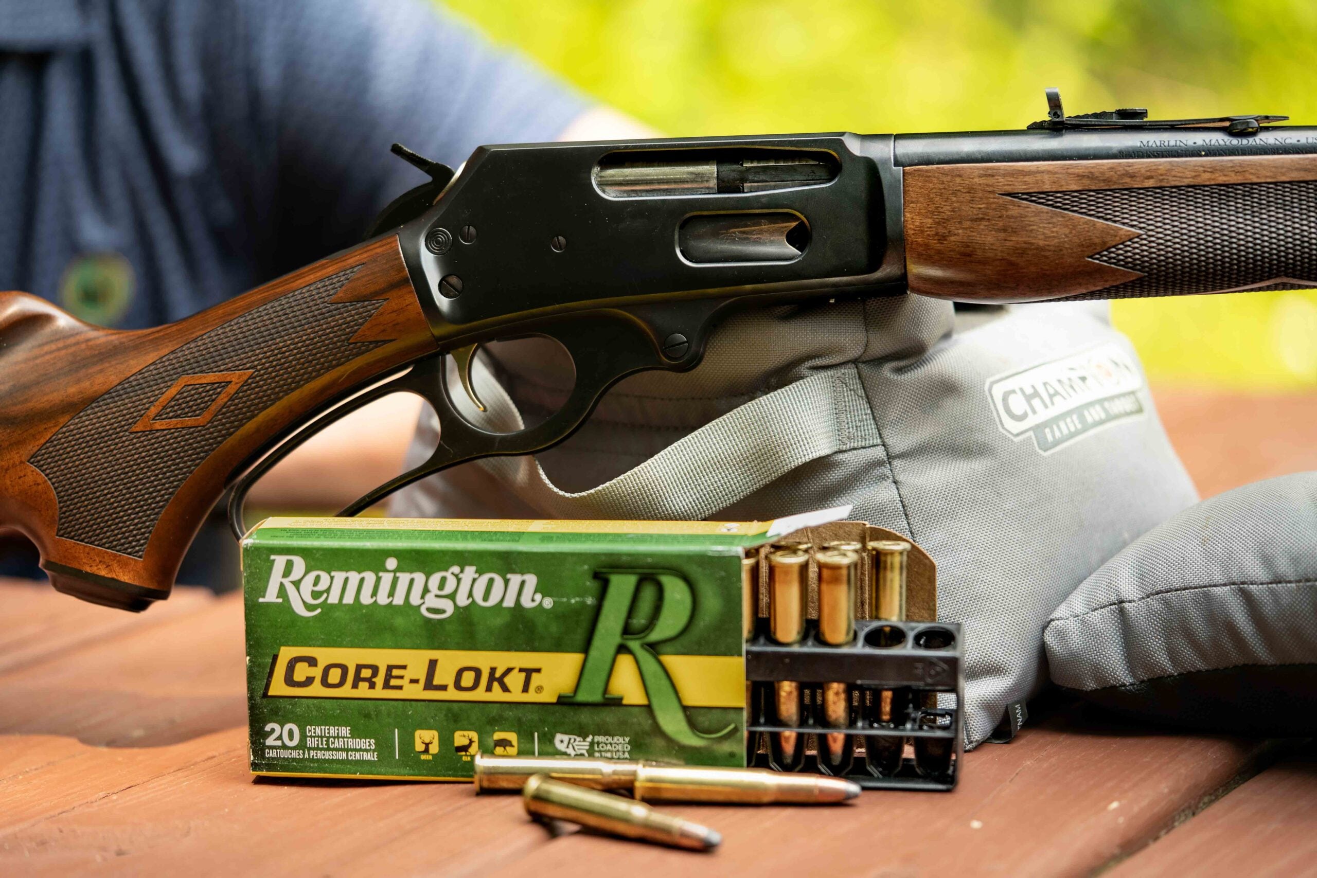 close-up of marlin rifle action with remington cartridges in front