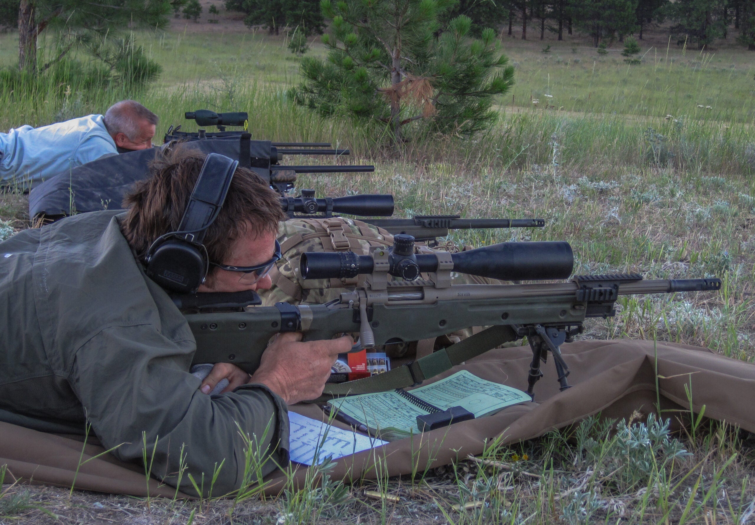 photo of shooters taking rifle shots at long range