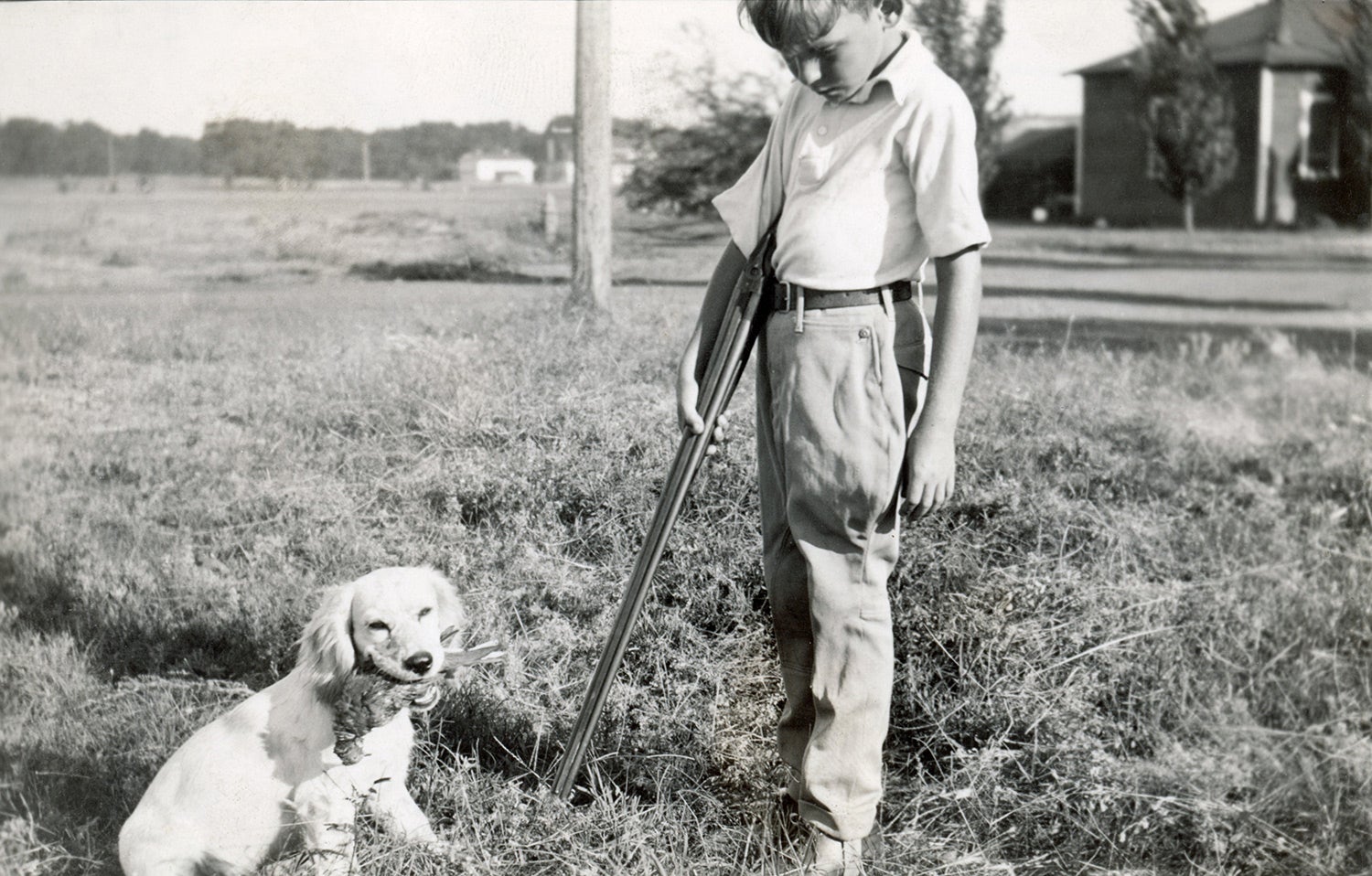 young boy and his hunting dog