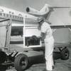 A dog is loaded onto an airplane