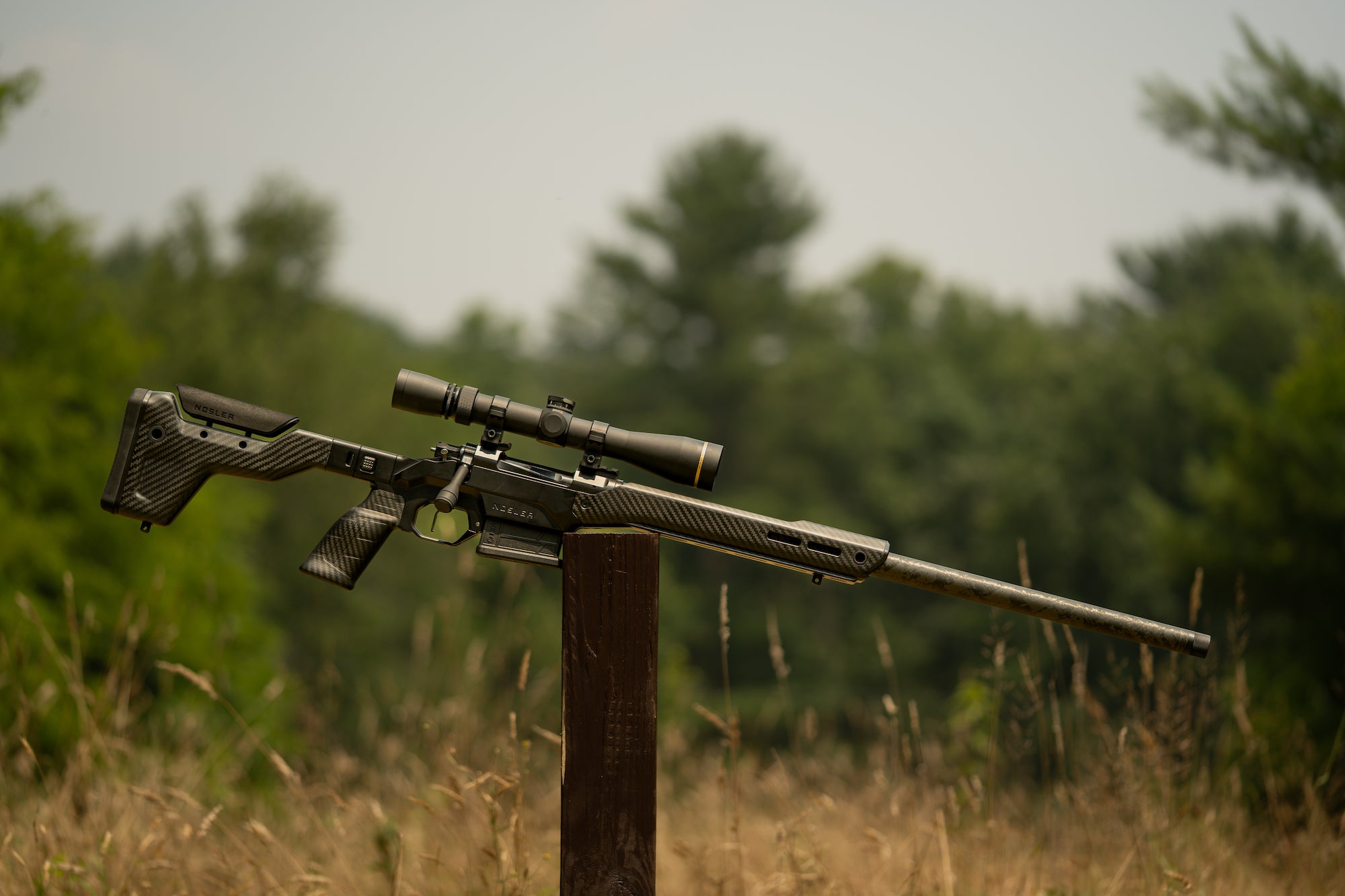 photo of the Nosler Carbon Chassis Hunter on a wooden post