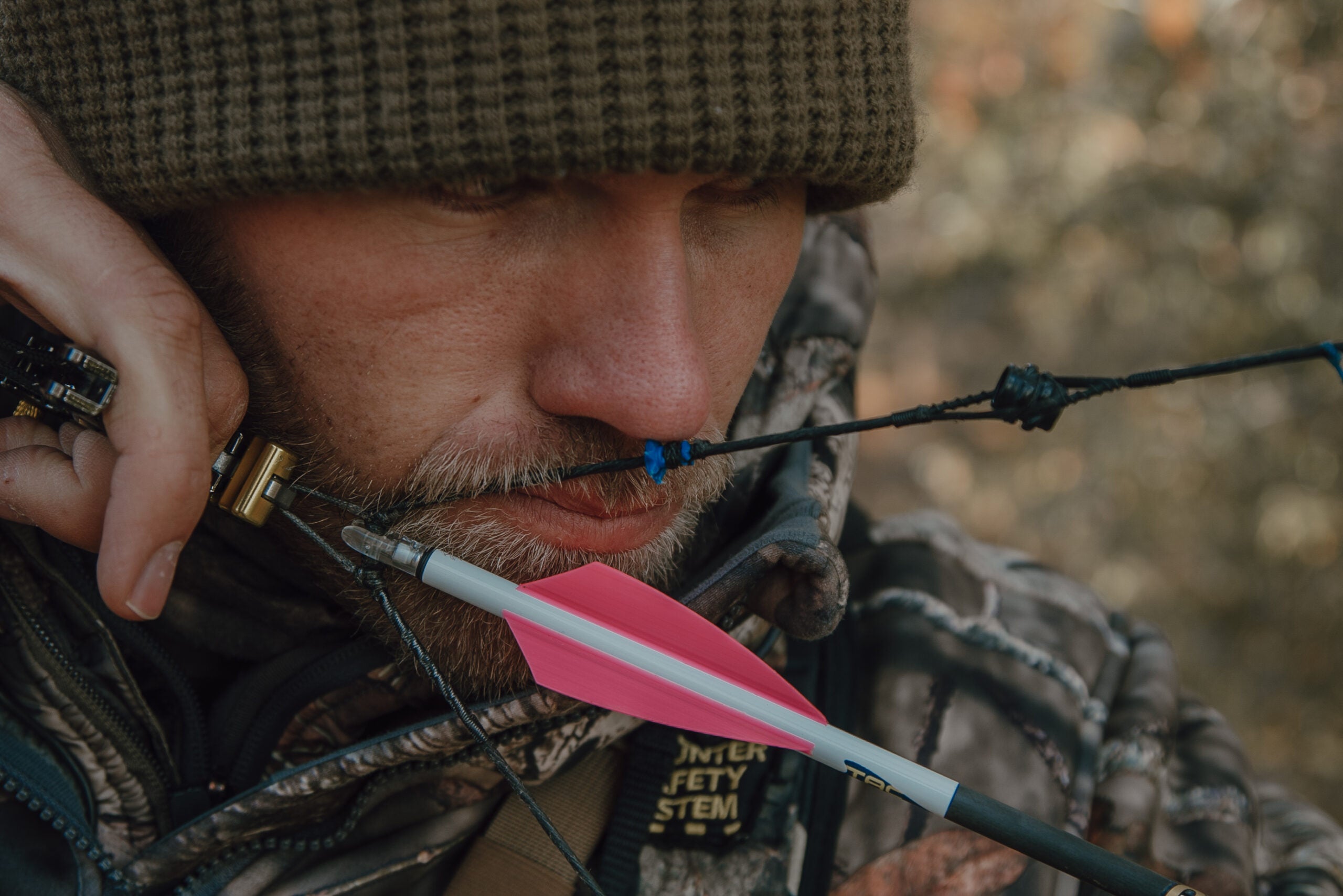 photo of a hunter at full draw with a bow