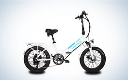The white Lectric XP step through folding fat tire bike on a black and white gradient background.
