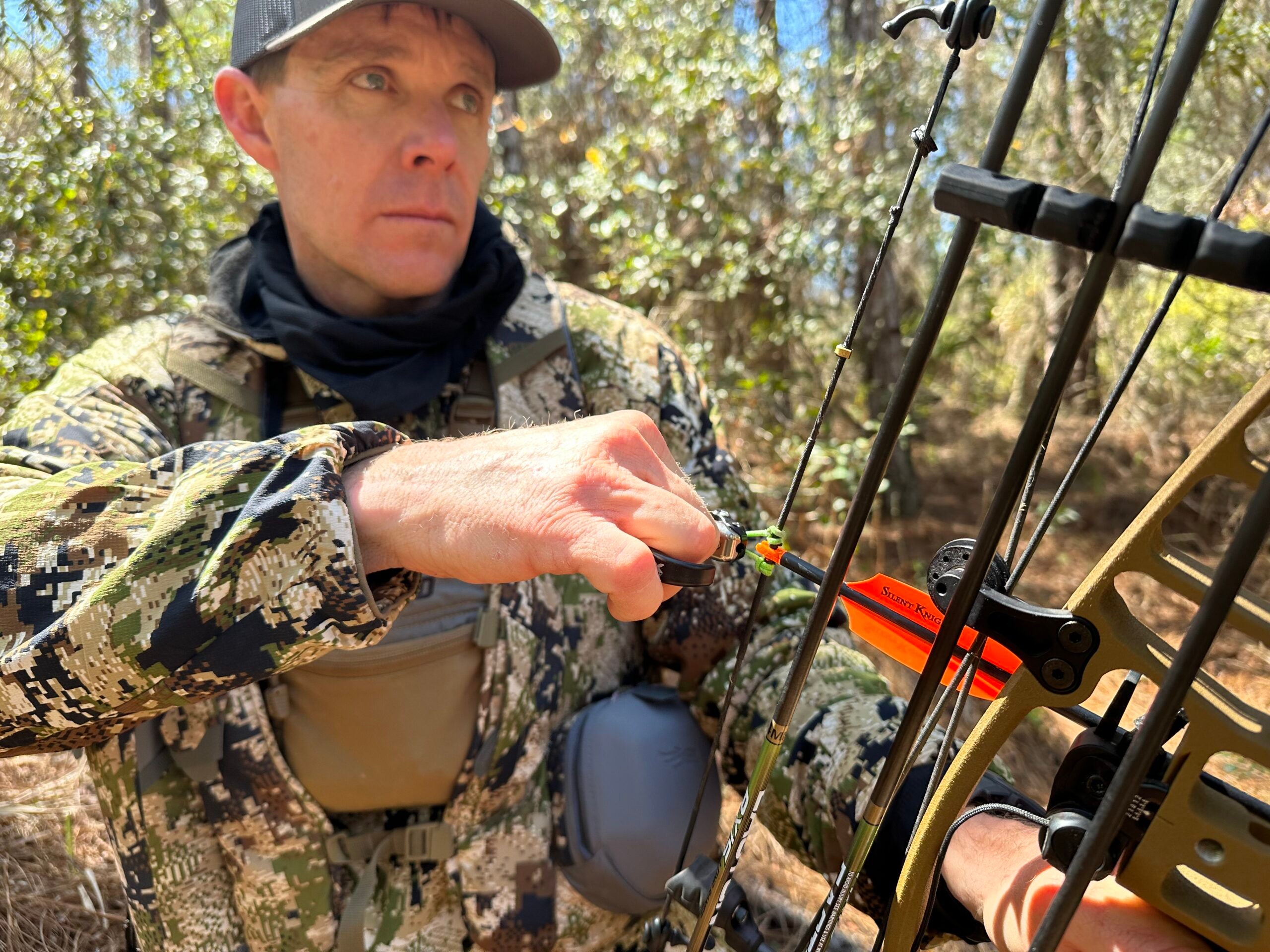 The author clips the HBC Quicksilver release to his bow. 