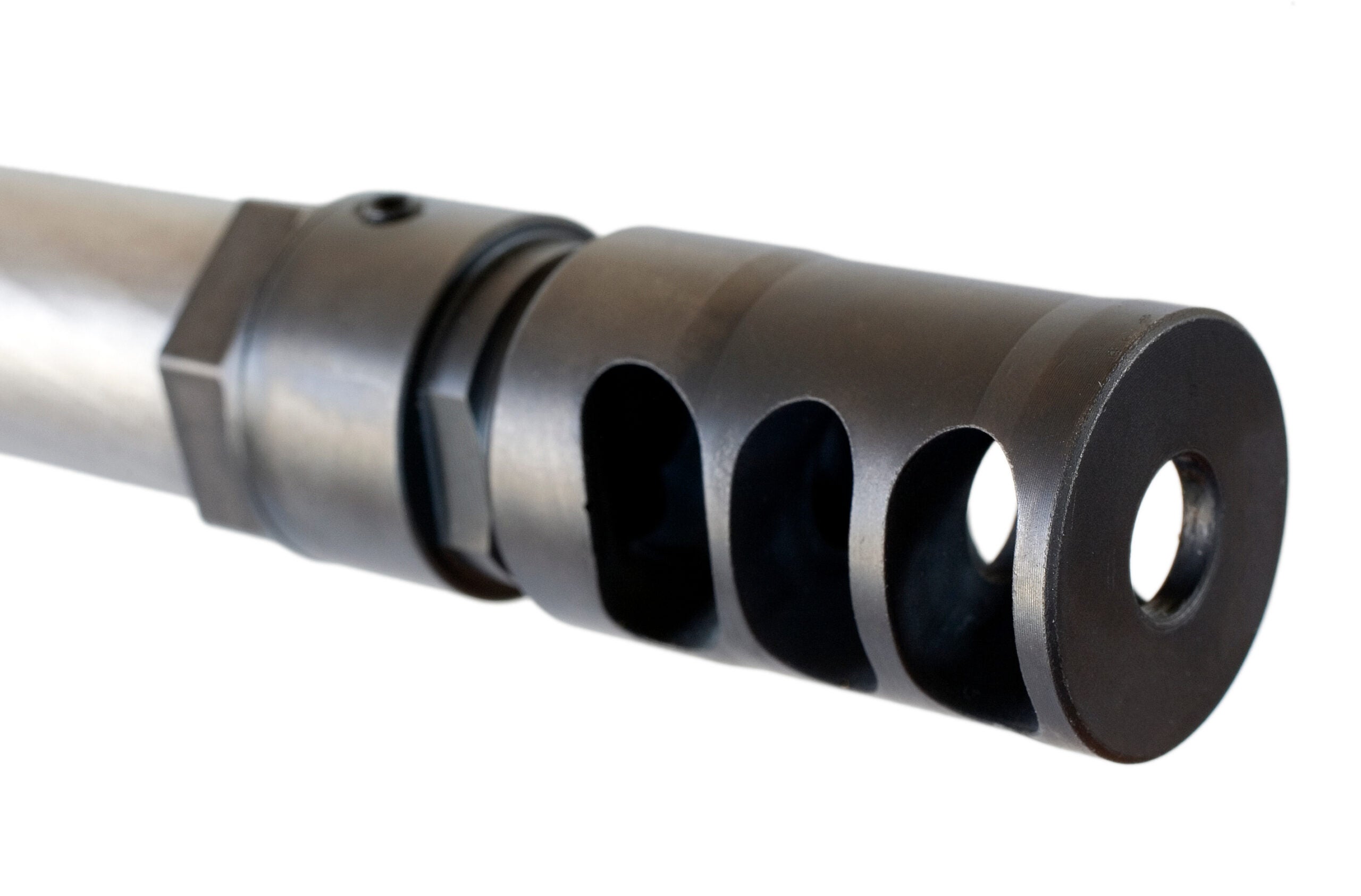 photo of a muzzle brake at the end of a rifle barrel