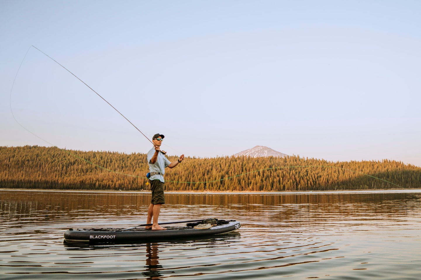 A longer paddleboard offers good stability for anglers.