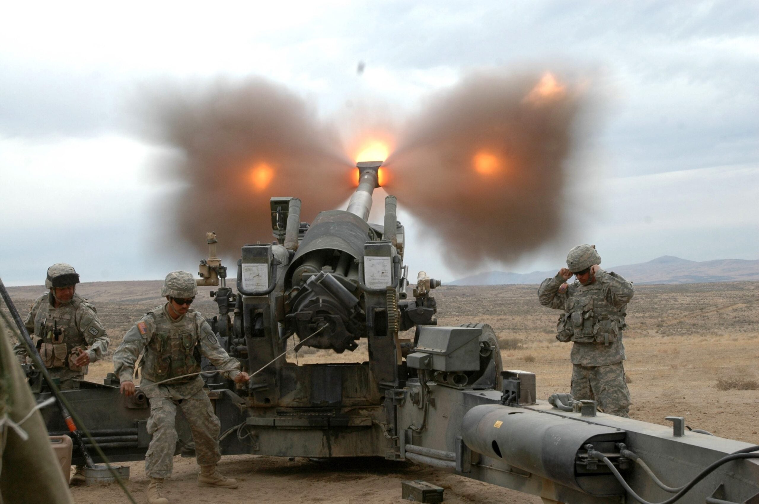 photo of a large military artillery piece with a muzzle brake
