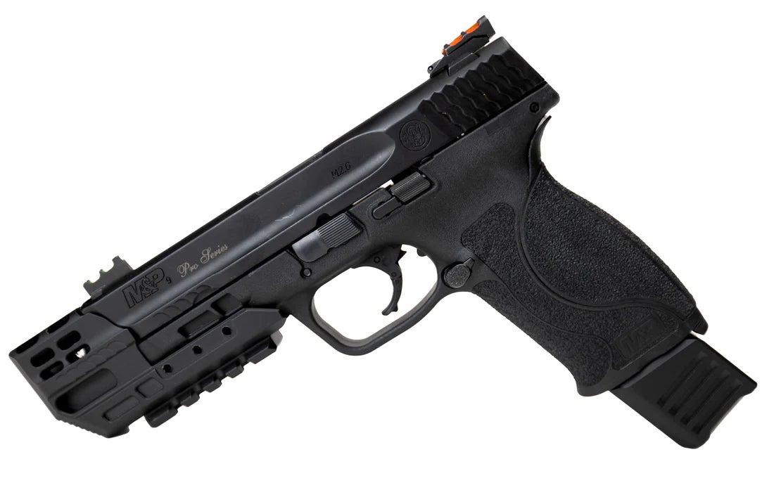 a handgun with a compensator on the end of the barrel