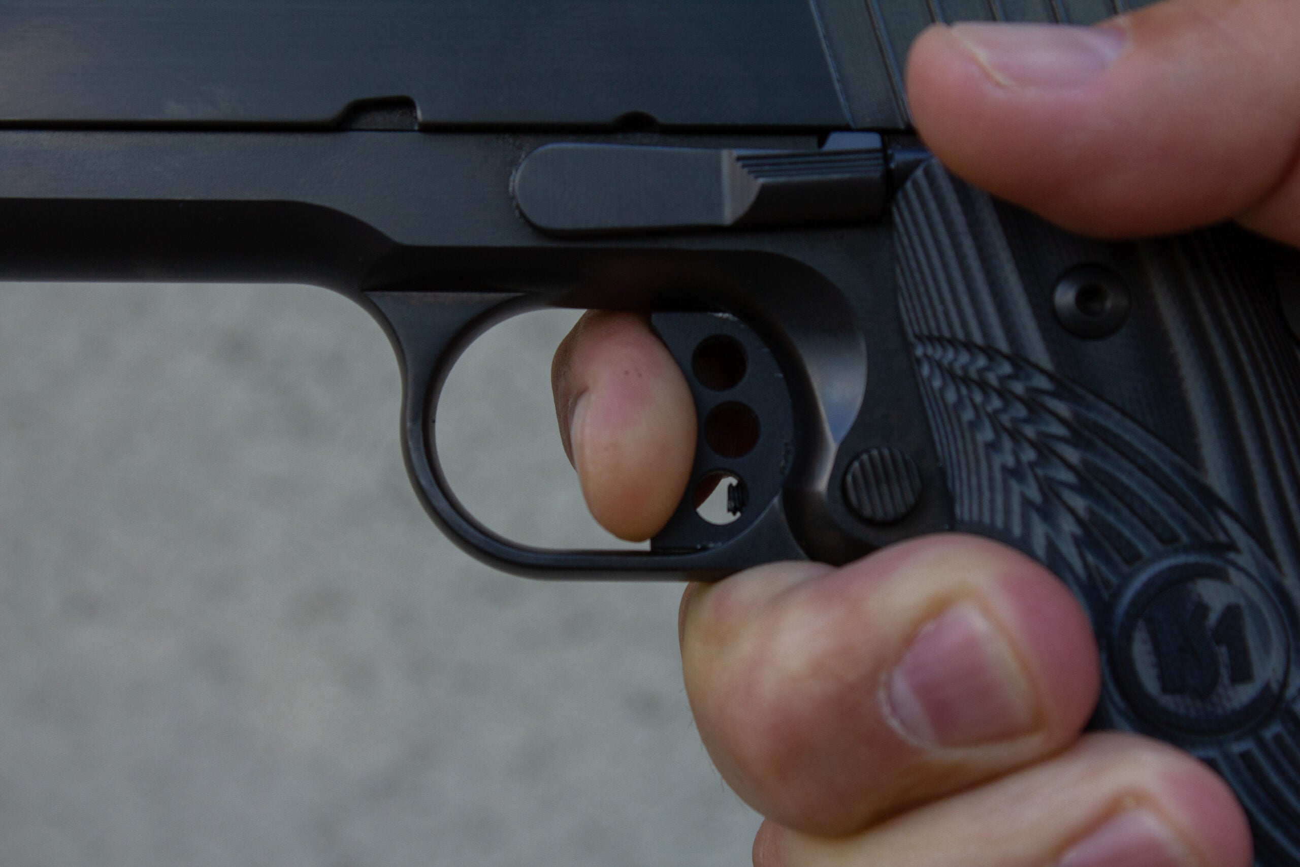 photo showing the proper way to press the trigger on a pistol