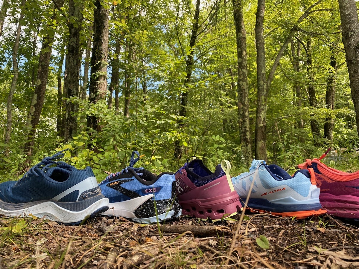The best trail running shoes lined up on a hiking trail