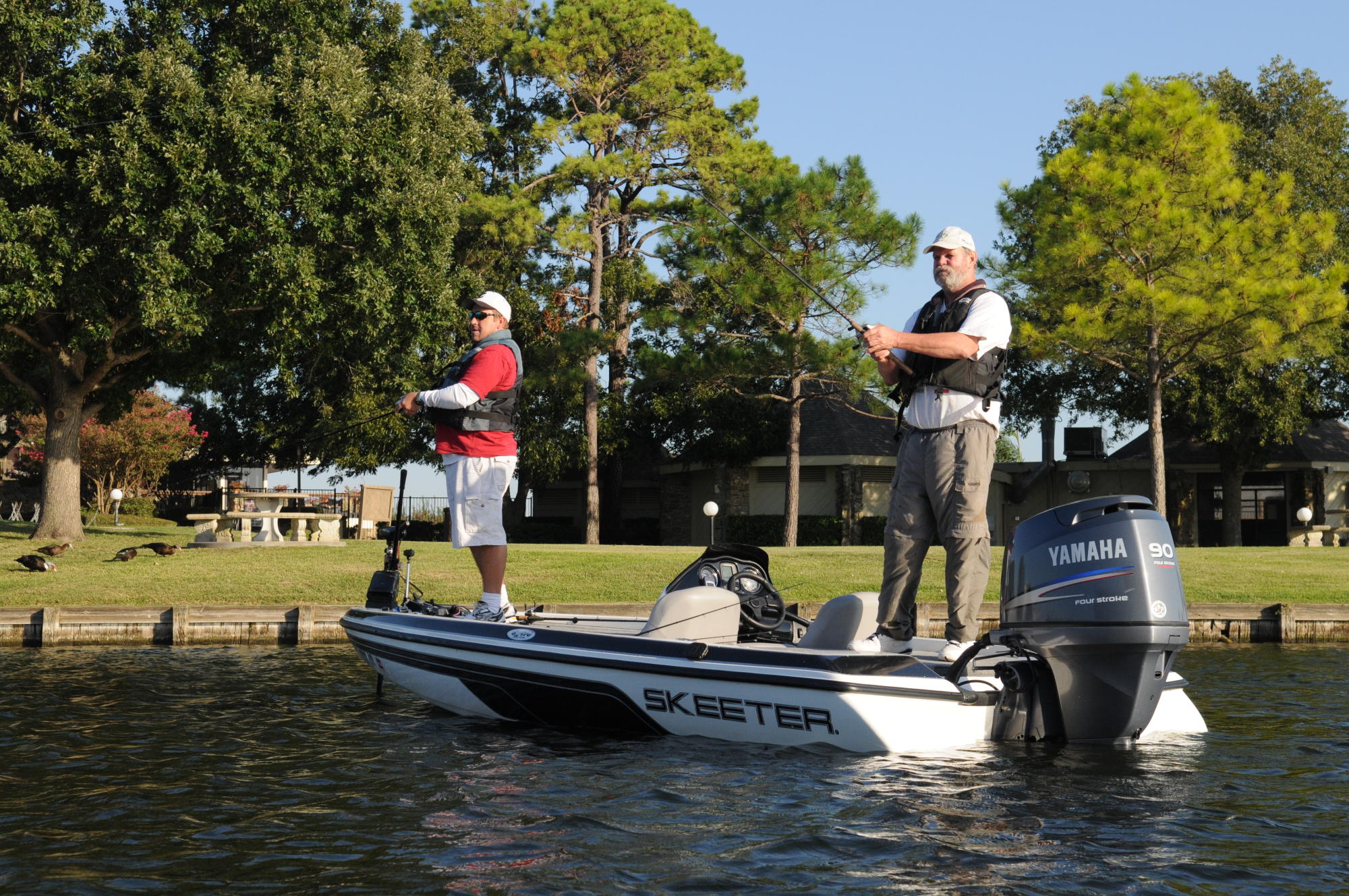 photo of bass anglers working the shoreline of Lake Conroe in Texas