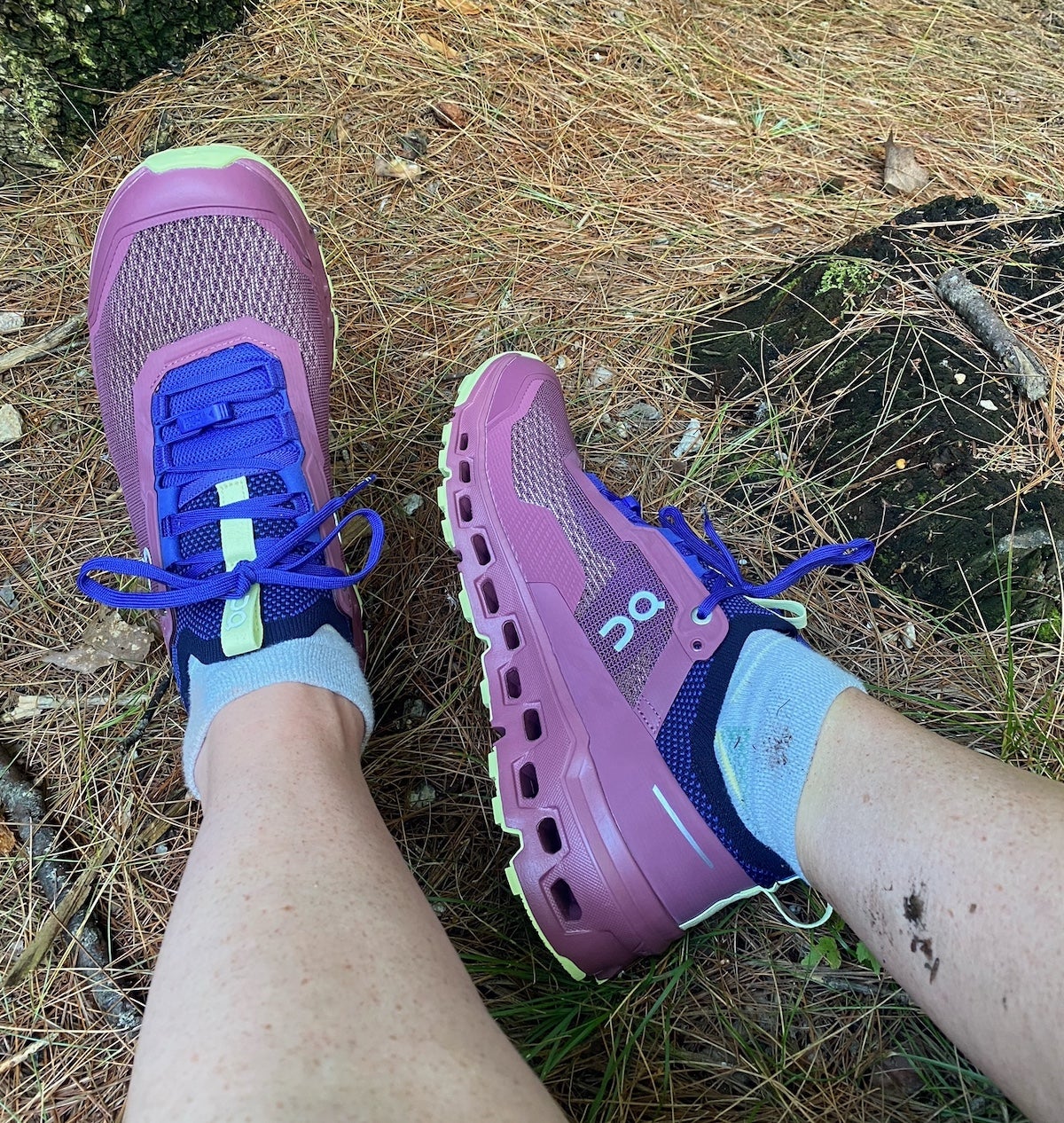 Woman wearing On Cloudultra 2 running shoes on the trail