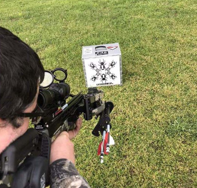 Man shooting crossbow at SpyderWeb 18XL target