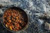 stew cooked inside a dutch oven is a perfect camping food idea for dinner