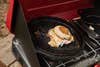egg sandwich cooking on a camp stove