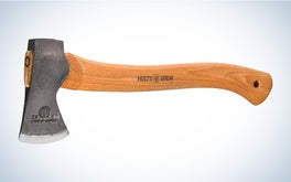 A wooden handled Hults Burk Almike camp axe on a black and white gradient background.