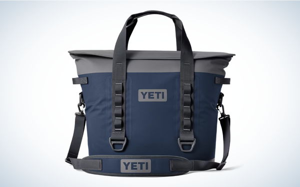 The blue and gray Yeti Hopper M30 Soft Cooler on a gray and white gradient background.