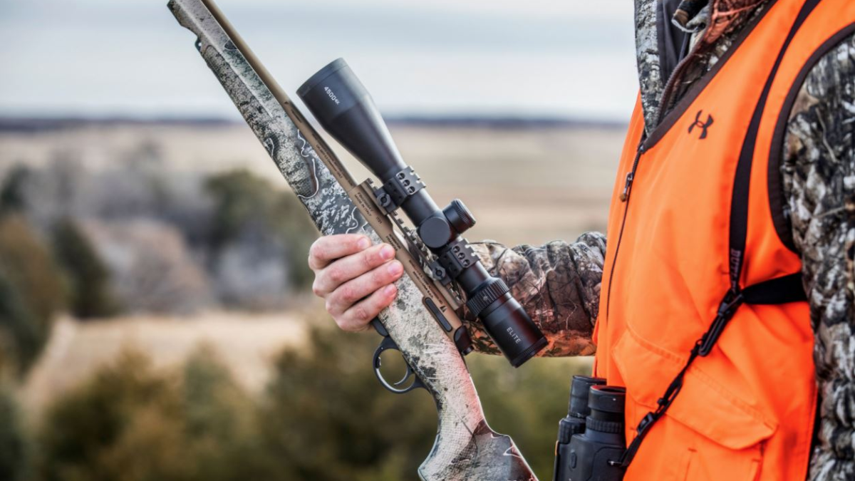 Hunter holding rifle with Bushnell scope