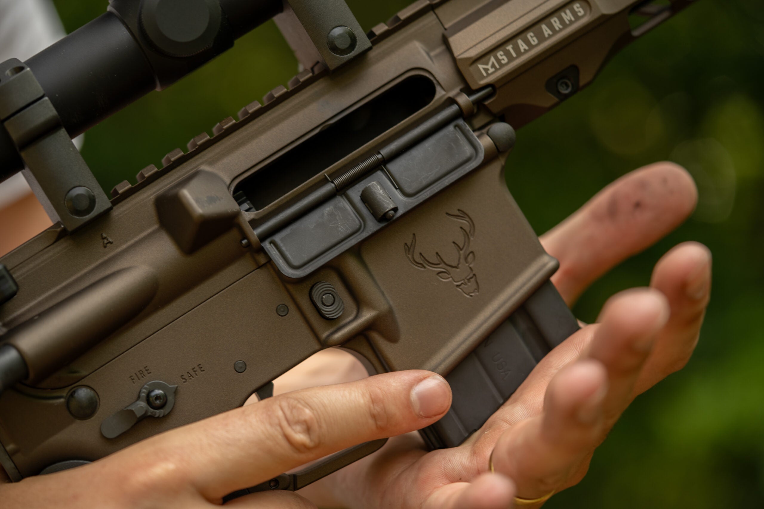 Field & Stream writer loading a magazine into a Stag 15 Pursuit rifle during a product review