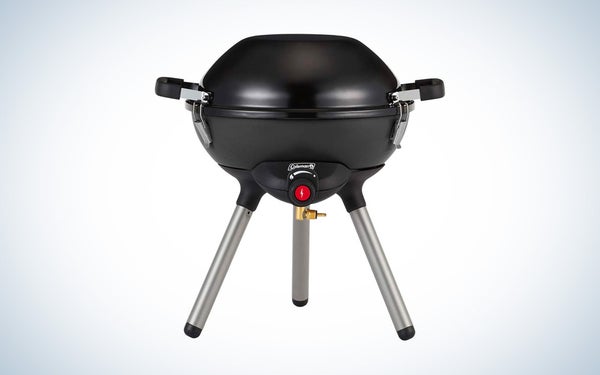 The Coleman 4-in-1 portable grill on a black and white gradient background.